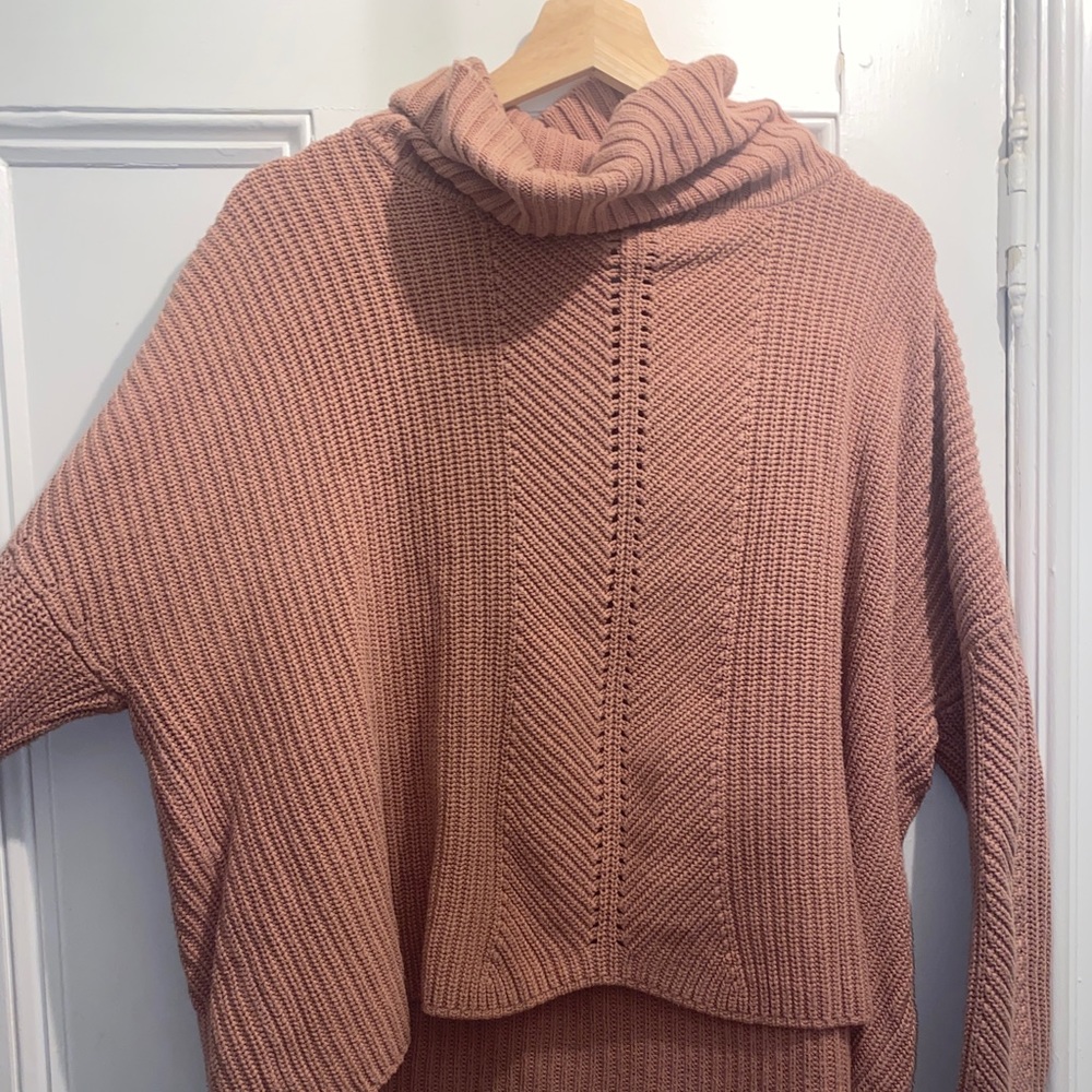 pink turtleneck sweater